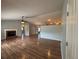 Open-concept living room with vaulted ceiling, fireplace, and modern ceiling fans at 3210 Se 54Th Cir, Ocala, FL 34480
