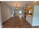 Inviting living space with wood floors flowing into the dining and kitchen areas at 3210 Se 54Th Cir, Ocala, FL 34480
