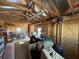 Shed interior features storage, sofa, shelves, desk, and good lighting at 3210 Se 54Th Cir, Ocala, FL 34480