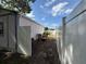 Side yard access with privacy fence and access to the storage shed at 3210 Se 54Th Cir, Ocala, FL 34480