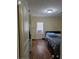Bedroom with hardwood floors and a window providing natural light, creating a relaxing atmosphere at 1710 Hamilton St, Bartow, FL 33830