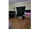 Bedroom featuring hardwood floors and a window providing natural light, creating a relaxing atmosphere at 1710 Hamilton St, Bartow, FL 33830