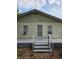 Charming home exterior featuring a simple facade and a welcoming entrance with stairs at 1710 Hamilton St, Bartow, FL 33830