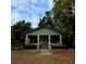 Charming bungalow with a covered front porch and classic architectural details in a treed yard at 1710 Hamilton St, Bartow, FL 33830