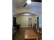 Inviting living room features hardwood floors, decorative archways and a ceiling fan at 1710 Hamilton St, Bartow, FL 33830