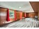 Spacious basement with wood paneling, windows, and laminate flooring at 3026 Pinedale Ave, Lakeland, FL 33803