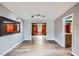 Bright and airy living room with hardwood floors and seamless transitions to adjoining rooms at 3026 Pinedale Ave, Lakeland, FL 33803