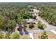 An aerial view shows this home is located in a mature forest near paved roads at 3690 Sw 175Th St, Ocala, FL 34473