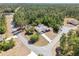 An aerial view shows this home is located on a paved road surrounded by mature trees at 3690 Sw 175Th St, Ocala, FL 34473