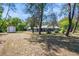 Spacious backyard with mature trees, shed, screened pool, and lush landscaping at 3690 Sw 175Th St, Ocala, FL 34473