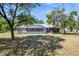 A secluded backyard and screened pool area are surrounded by large trees at 3690 Sw 175Th St, Ocala, FL 34473
