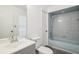 This bathroom features blue shower tile, a bathtub, and modern flooring at 3690 Sw 175Th St, Ocala, FL 34473