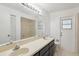 This bathroom features a large mirror, a double sink, and a tile shower at 3690 Sw 175Th St, Ocala, FL 34473