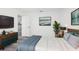 This bedroom features modern decor, a ceiling fan, and a view into the house at 3690 Sw 175Th St, Ocala, FL 34473