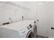 Bright laundry room features modern, front-load Samsung washer and dryer at 3690 Sw 175Th St, Ocala, FL 34473