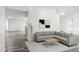 Bright living room featuring modern decor and stylish gray sectional at 3690 Sw 175Th St, Ocala, FL 34473