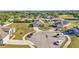 Aerial view of a residential neighborhood with well-maintained homes, mature trees, and cul-de-sac street at 513 Kimbrel Ct, Haines City, FL 33844