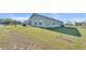 The spacious backyard offers ample room for outdoor activities and landscaping opportunities at 513 Kimbrel Ct, Haines City, FL 33844