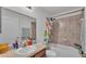 Bright bathroom featuring a shower-tub combo and a single sink vanity at 513 Kimbrel Ct, Haines City, FL 33844