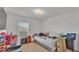 Cluttered, but cozy bedroom with bright window light at 513 Kimbrel Ct, Haines City, FL 33844