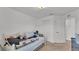Cluttered bedroom with a white wrought iron bed and neutral carpet at 513 Kimbrel Ct, Haines City, FL 33844