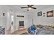 Bright, Star Wars themed bedroom with ceiling fan and adjacent hall at 513 Kimbrel Ct, Haines City, FL 33844