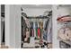 Walk-in closet includes metal racks and shelving for clothes, shoes, and accessories at 513 Kimbrel Ct, Haines City, FL 33844