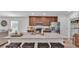 Gourmet kitchen boasts granite countertops, stainless steel appliances, and a breakfast bar with seating at 513 Kimbrel Ct, Haines City, FL 33844