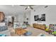 Open living space featuring modern decor, a large TV, and seamless flow to the kitchen at 513 Kimbrel Ct, Haines City, FL 33844