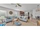 Bright living room with ceiling fan and seamless flow into the kitchen and dining area at 513 Kimbrel Ct, Haines City, FL 33844