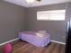Bedroom with natural light from the window and vinyl plank flooring at 5225 Imperial Lakes Blvd # 52, Mulberry, FL 33860