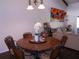 Warm dining room featuring a round table set for six, with artful decor at 5225 Imperial Lakes Blvd # 52, Mulberry, FL 33860
