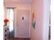 Entryway with a neutral-colored front door, a console, and light from the window at 5225 Imperial Lakes Blvd # 52, Mulberry, FL 33860