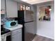 This cozy kitchen offers gray cabinets, updated appliances, and bright countertops at 5225 Imperial Lakes Blvd # 52, Mulberry, FL 33860