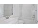 Clean bathroom featuring white vanity, toilet, and shower with bathtub, providing a refreshing space at 5844 Sw 87Th Ave, Ocala, FL 34481