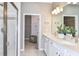 Well-lit bathroom with double vanity, walk-in shower, and neutral color scheme at 5844 Sw 87Th Ave, Ocala, FL 34481