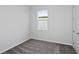 Cozy bedroom with neutral carpet, window, and white trim, offering a comfortable retreat at 5844 Sw 87Th Ave, Ocala, FL 34481