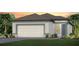 Charming home with a two-car garage, neutral color palette and front yard landscaping at 5844 Sw 87Th Ave, Ocala, FL 34481