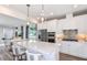 Modern kitchen with white cabinets, stainless steel appliances, and a center island at 5844 Sw 87Th Ave, Ocala, FL 34481