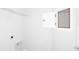 Clean laundry room features white walls with storage shelf at 5844 Sw 87Th Ave, Ocala, FL 34481