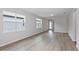Bright living room featuring modern flooring and ample natural light, creating an inviting space at 5844 Sw 87Th Ave, Ocala, FL 34481