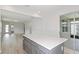 The airy living area offers an open floor plan with luxury vinyl plank flooring and access to the outdoors at 5844 Sw 87Th Ave, Ocala, FL 34481