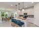 Modern kitchen with granite countertops, stainless steel appliances, and an island with bar seating at 8199 Sw 52Nd Lane Rd, Ocala, FL 34481