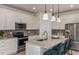 Well-equipped kitchen boasts sleek appliances, ample storage, and a stylish granite-topped center island at 8199 Sw 52Nd Lane Rd, Ocala, FL 34481