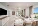 Bright living room featuring contemporary furnishings and a view of the entry at 8283 Sw 54Th Loop, Ocala, FL 34481