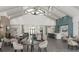 A stylish lounge area features comfortable seating, a fireplace, and a bar, creating a welcoming space at 8283 Sw 54Th Loop, Ocala, FL 34481