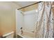 Bathroom featuring a shower-tub combination with colorful shower curtain at 2523 Jasmine Trace Dr, Kissimmee, FL 34758