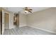 Spacious bedroom featuring wood-look flooring and a ceiling fan for comfortable living at 2523 Jasmine Trace Dr, Kissimmee, FL 34758