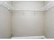 Walk-in closet offering ample storage space with wire shelving at 2523 Jasmine Trace Dr, Kissimmee, FL 34758