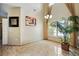 Bright dining room with large windows, tall ceilings, neutral walls and decorative light fixture at 2523 Jasmine Trace Dr, Kissimmee, FL 34758